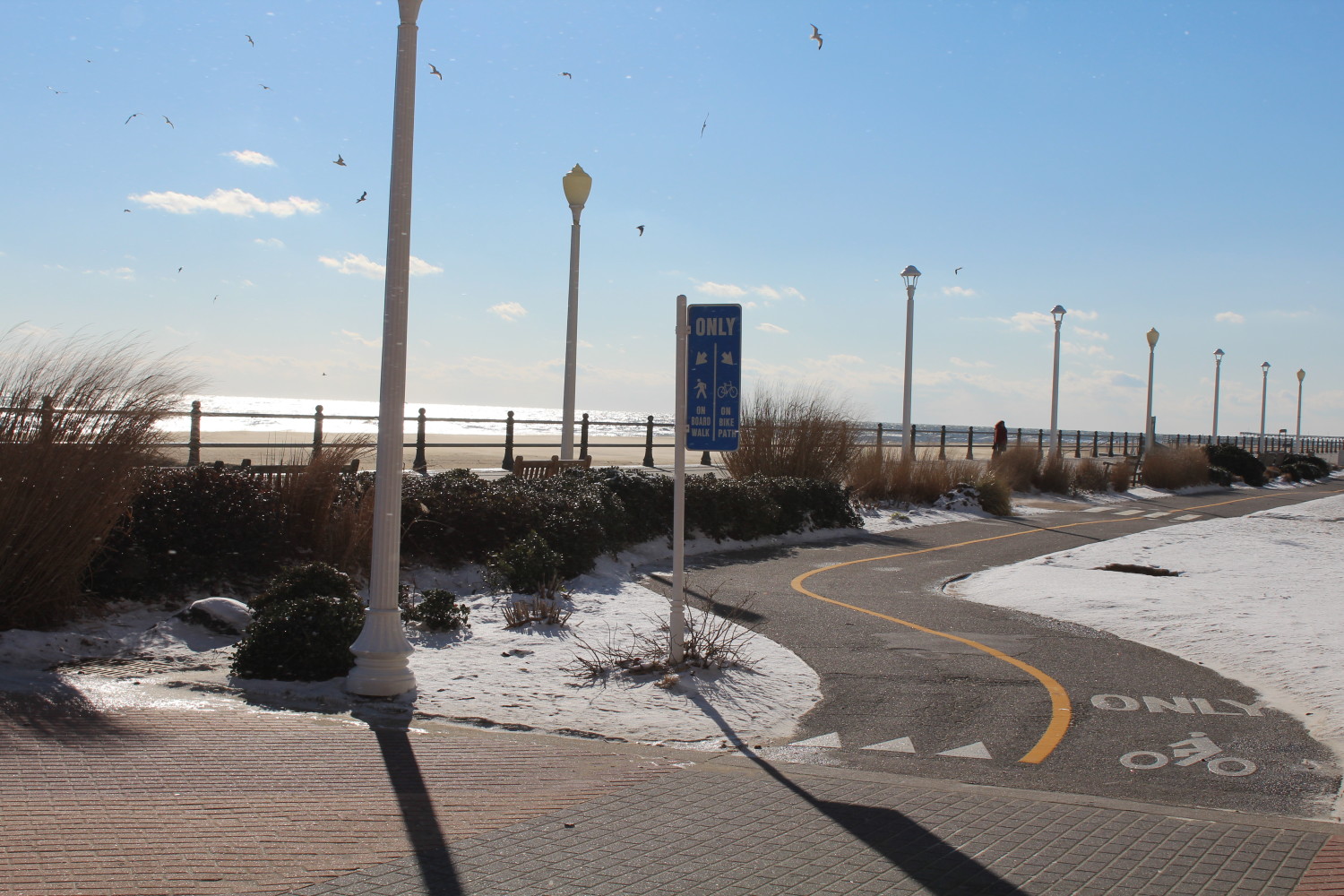 Snow lays around the well-maintained bike trail at the Virginia Beach Oceanfront.